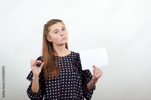 Εκτύπωση καμβά Fair-haired beautiful girl in a black dress with white circles white paper in ha
