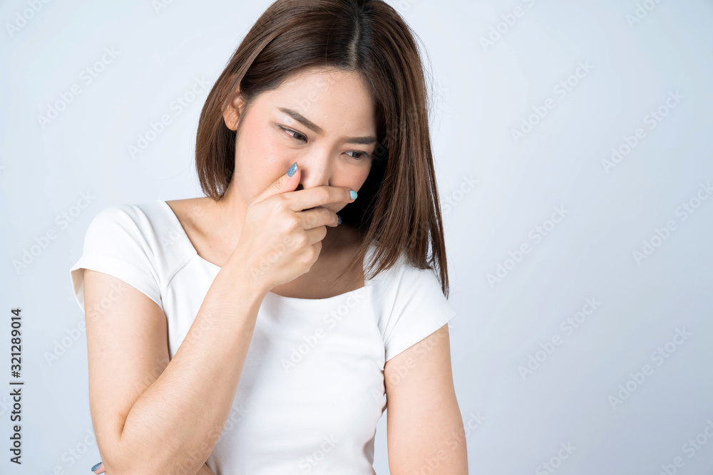 Asian women have sneezing and difficulty breathing, Isolated on a white background. Asian women have sneezing and difficulty breathing, Isolated on a white background.