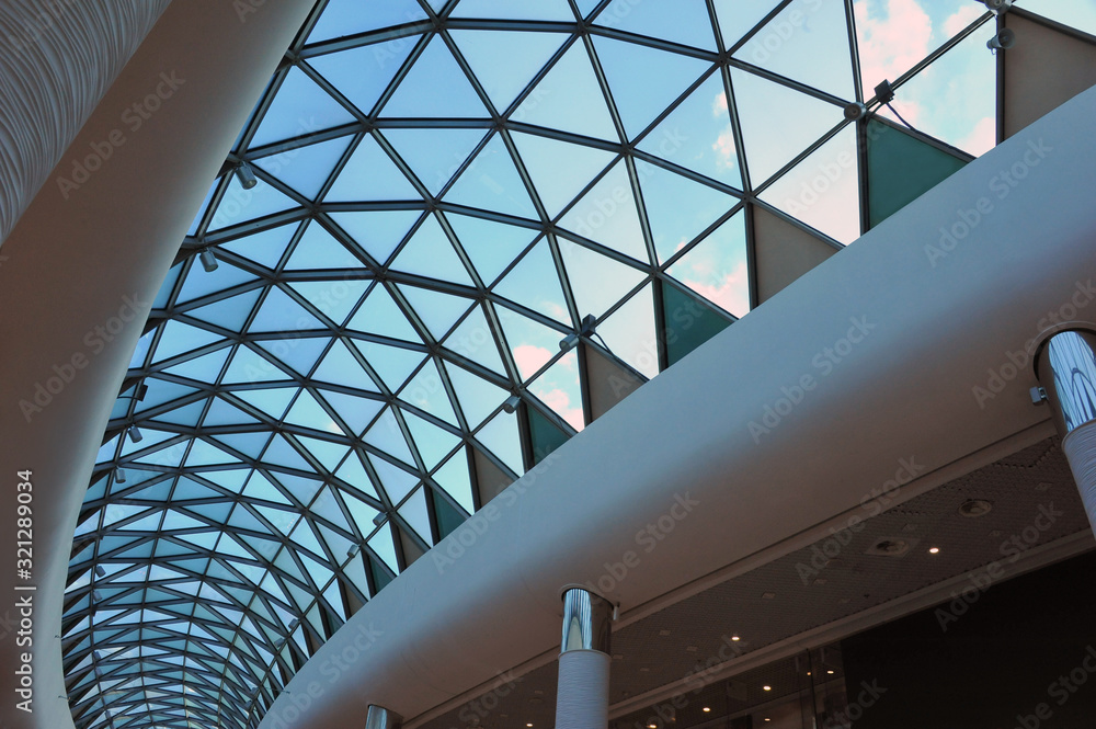 Fototapeta premium Reinforced concrete construction. Ceiling. New technologies. Arc polycarbonate canopy and reinforced concrete construction. Metal construction.