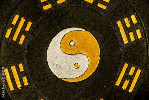 Chinese Taoism symbol with yin and yang sign photo