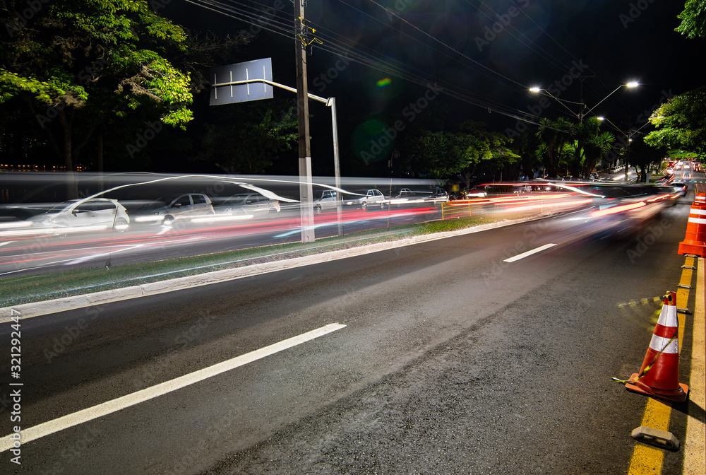 Car traffic at the Higienopolis avenue - Londrina PR Brazil. Photo at night.