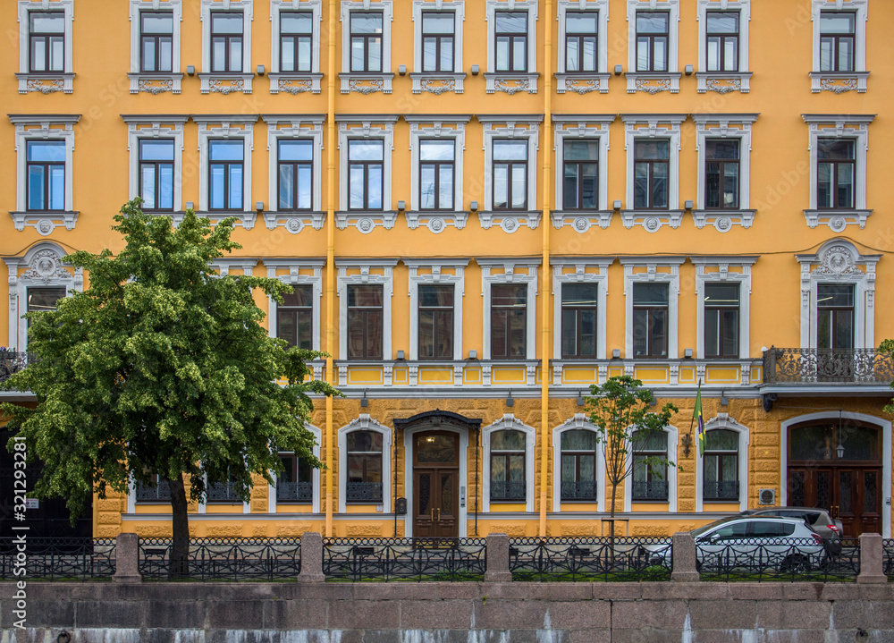 bright yellow facade of the historic building facade in the city