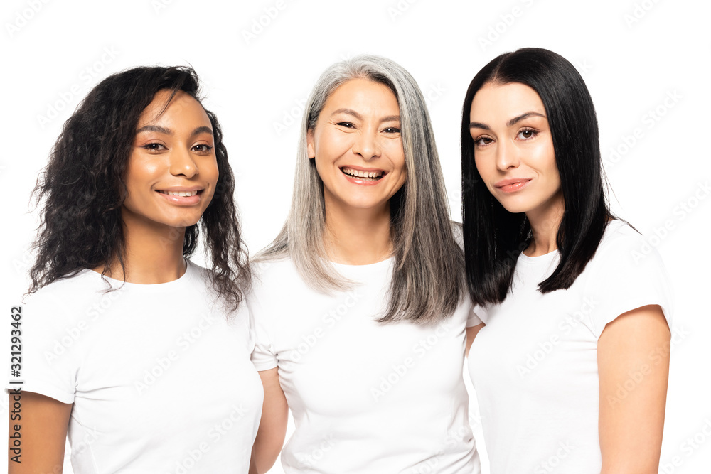 cheerful multicultural women looking at camera isolated on white cheerful multicultural women looking at camera isolated on white