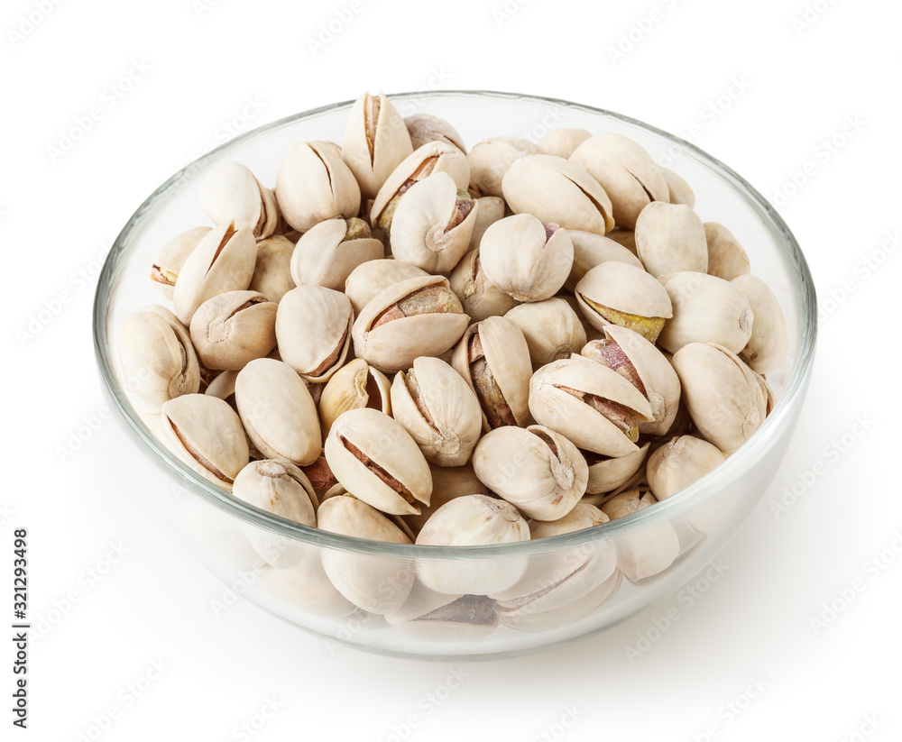 Salted pistachios in glass bowl isolated on white background with clipping path Salted pistachios in glass bowl isolated on white background with clipping path
