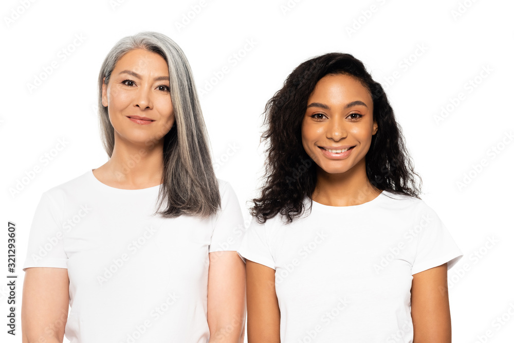 happy african american and asian women looking at camera isolated on white happy african american and asian women looking at camera isolated on white