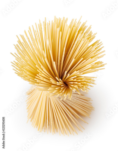 Uncooked dried spaghetti pasta isolated on white background with clipping path