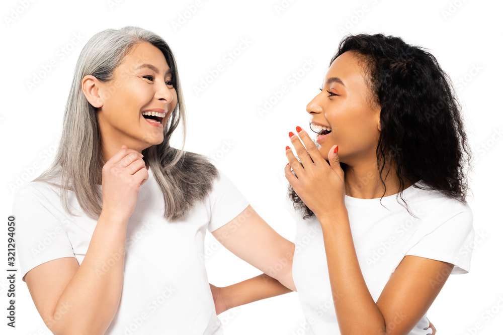 happy african american and asian women laughing isolated on white happy african american and asian women laughing isolated on white