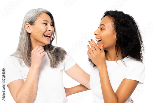 happy african american and asian women laughing isolated on white