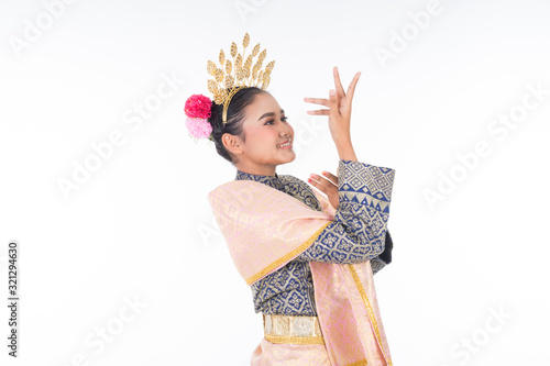 A beautiful Malaysian traditional female dancer wearing traditional dance outfit. Half length portrait isolated in white. Landscape orientation.