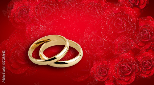 Golden Wedding rings on Romantic red roses with water droplets