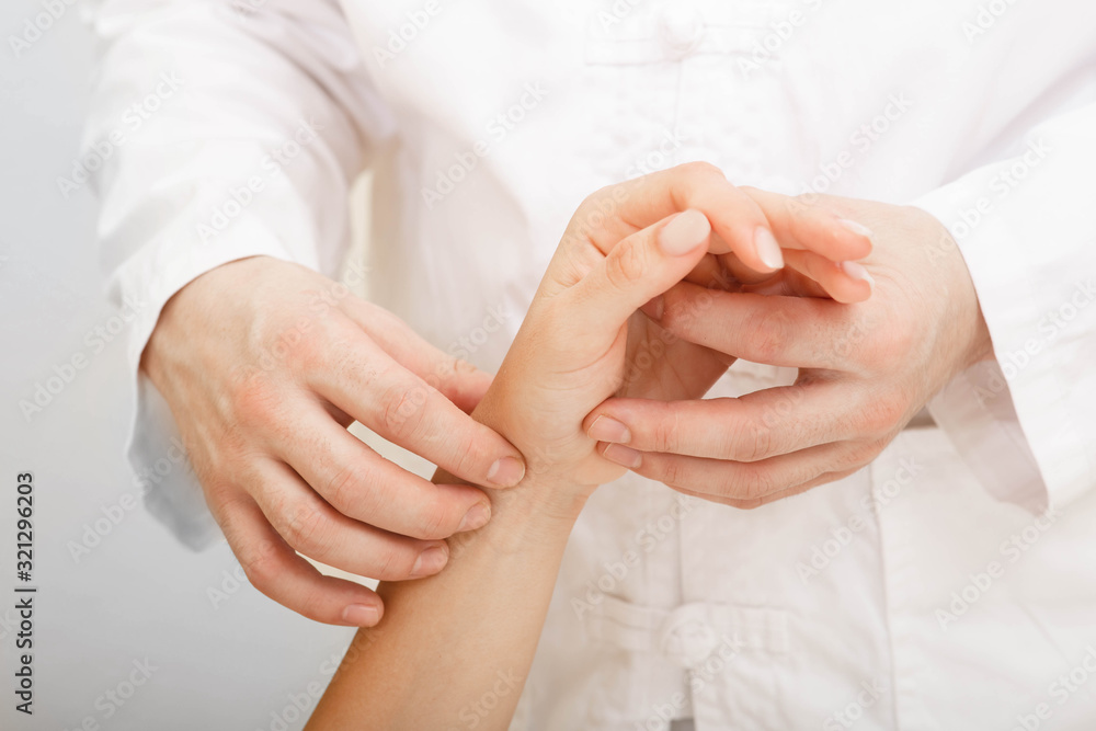 Doctor checking heart rate on wrist women. Doctor take care of patient's health in hospital Doctor checking heart rate on wrist women. Doctor take care of patient's health in hospital