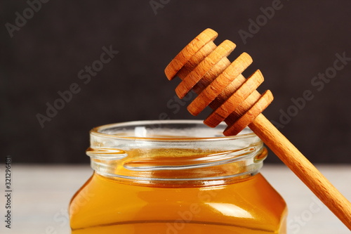 Jar of Honey with Honey Dipper photo