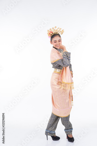 A beautiful Malaysian traditional female dancer performing a cultural dance routine called Tarian Joget in a traditional dance outfit. Full length isolated in white.