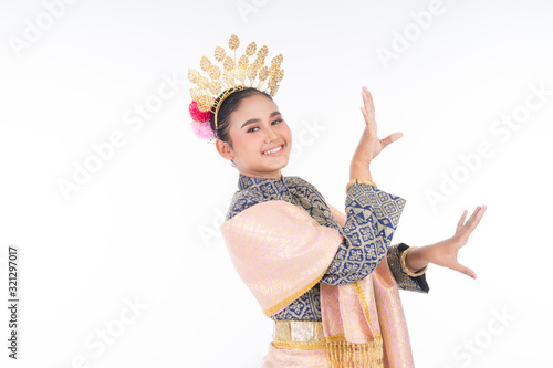 A beautiful Malaysian traditional female dancer wearing traditional dance outfit. Half length portrait isolated in white. Landscape orientation. photo