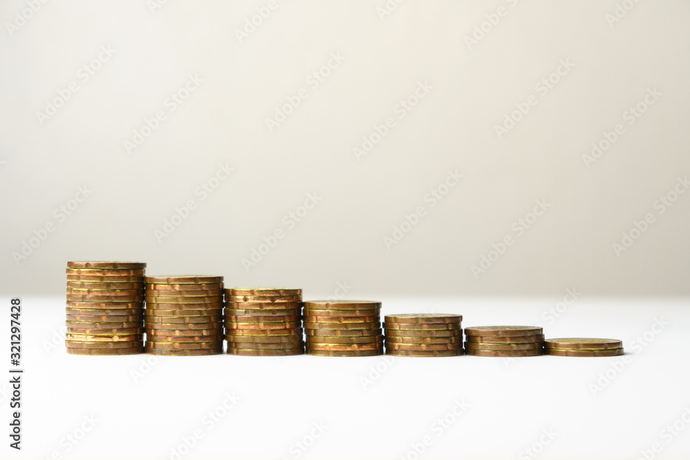 growing growth saving money. money stack step up against blank background. financial business investment concept. free copy space for text. growing growth saving money. money stack step up against blank background. financial business investment concept. free copy space for text.
