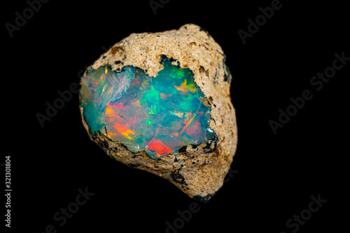 Obraz na płótnie macro mineral stone rare and beautiful opals on a black background