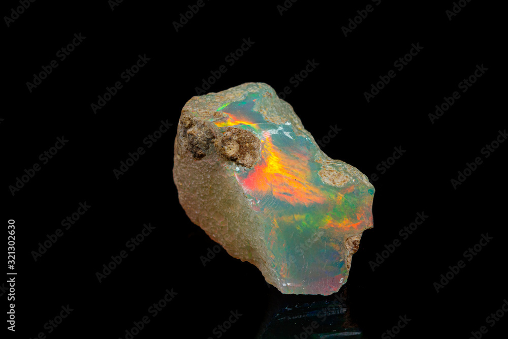 macro mineral stone rare and beautiful opals on a black background macro mineral stone rare and beautiful opals on a black background