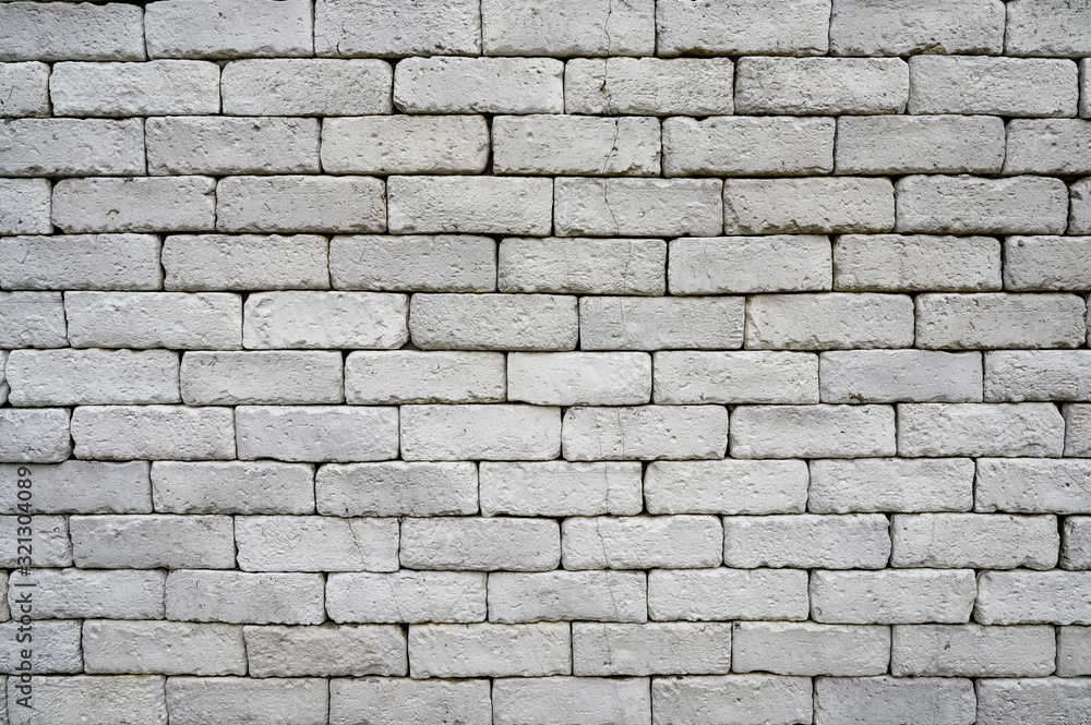 Weathered grey brick wall for texture and background Weathered grey brick wall for texture and background