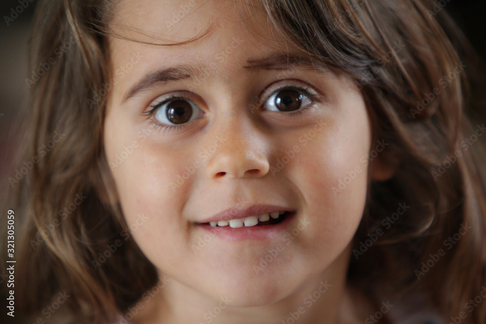 4 and a half year old girl looking at the camera 4 and a half year old girl looking at the camera