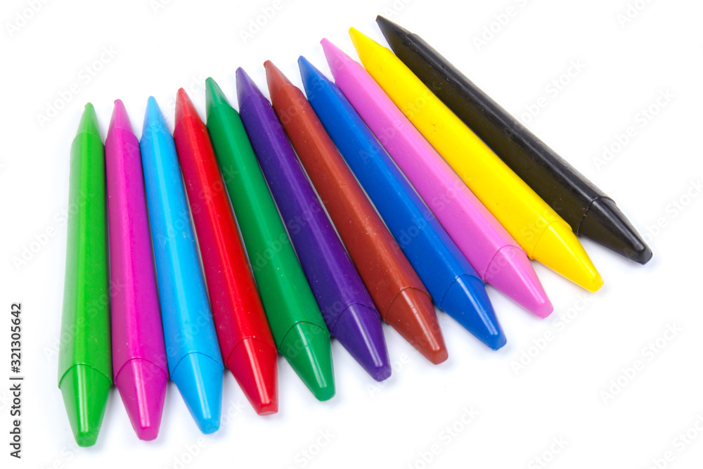 Colored wax pencils. A bunch on white background close-up