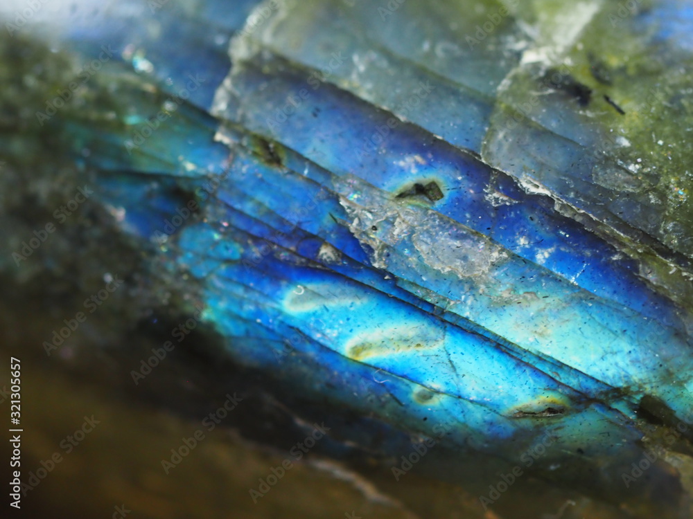 Macro of a Labradorite Stone Showing Blue Iridescent Inclusions Macro of a Labradorite Stone Showing Blue Iridescent Inclusions