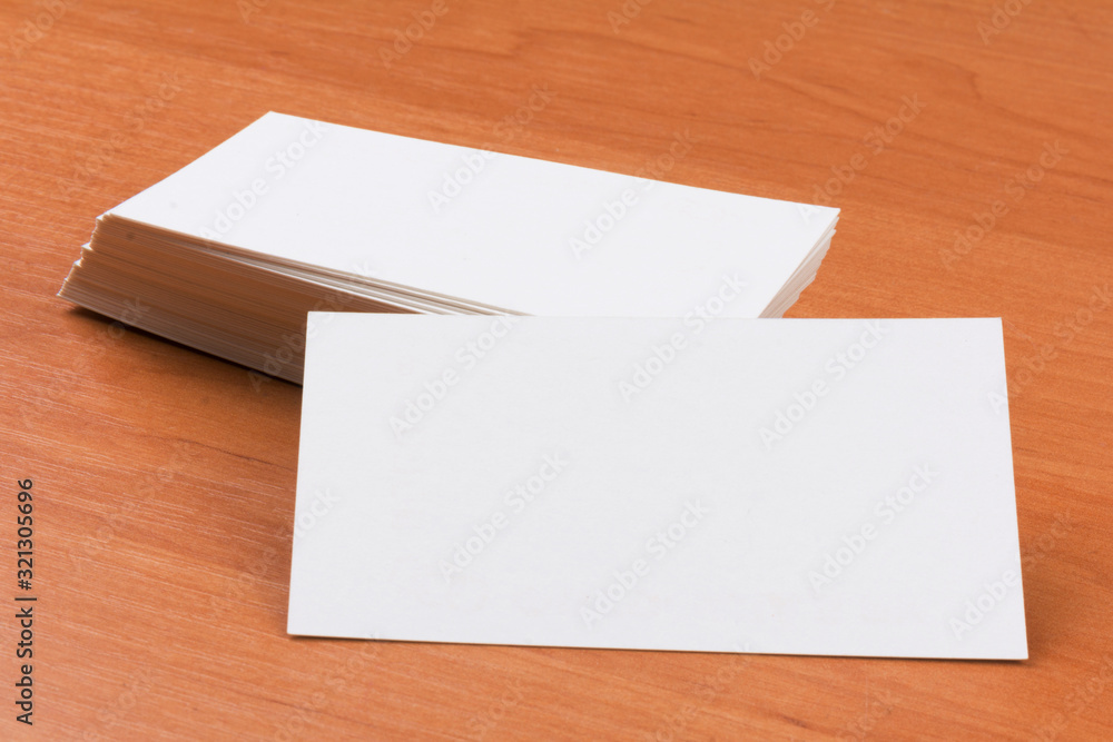 white blank business cards on wooden background.close-up white blank business cards on wooden background.close-up