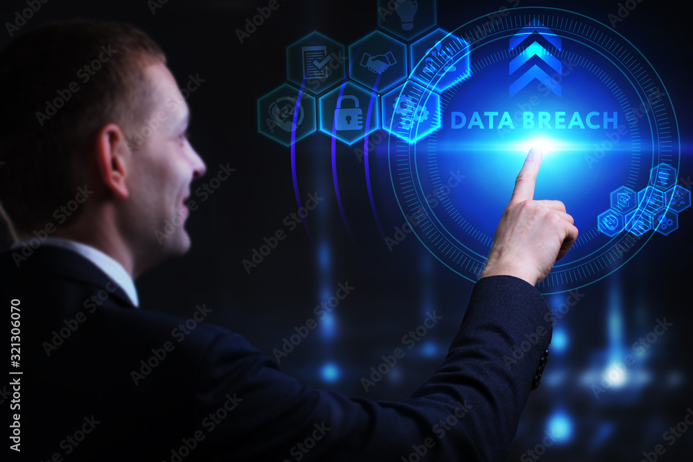 Business, Technology, Internet and network concept. Young businessman working on a virtual screen of the future and sees the inscription: Data breach Business, Technology, Internet and network concept. Young businessman working on a virtual screen of the future and sees the inscription: Data breach