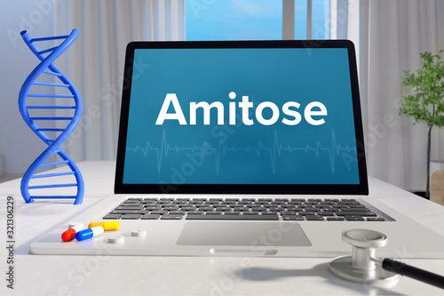 Amitose – Medizin/Gesundheit. Computer im Büro mit Begriff auf dem Bildschirm. Arzt/Gesundheitswesen