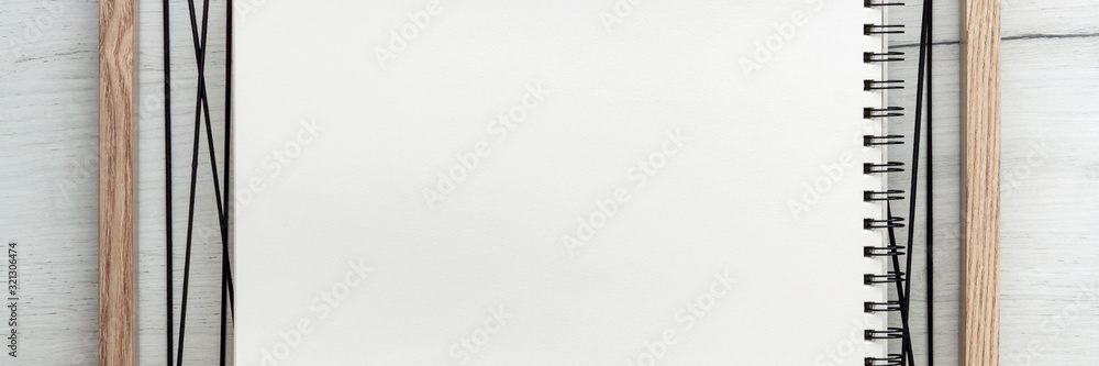 Wooden white desk with a wooden frame. Mockup. Copy space. Office notebook. Scandinavian style. Geometry.Panoramic photo Wooden white desk with a wooden frame. Mockup. Copy space. Office notebook. Scandinavian style. Geometry.Panoramic photo