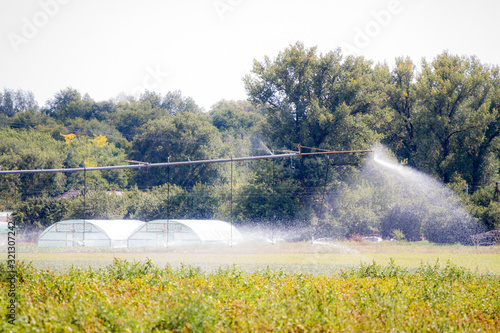 Arid irrigation system for arid areas to increase yield. Agricultural watering of fields.