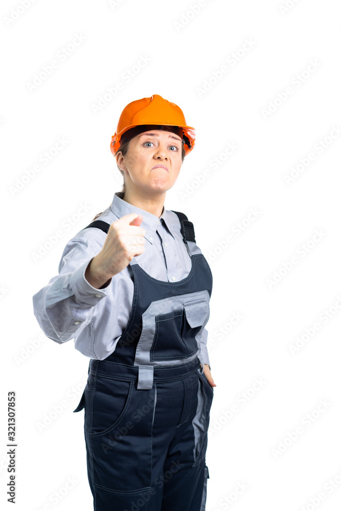 girl builder engineer shows finger to camera FIG. Isolated girl builder engineer shows finger to camera FIG. Isolated