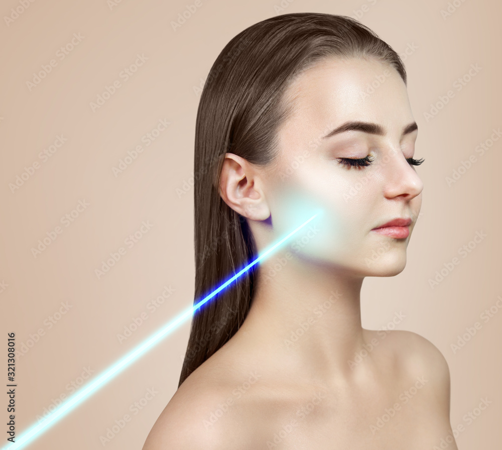 Cosmetics laser ray on beautiful female face. Laser treatment concept. Cosmetics laser ray on beautiful female face. Laser treatment concept.
