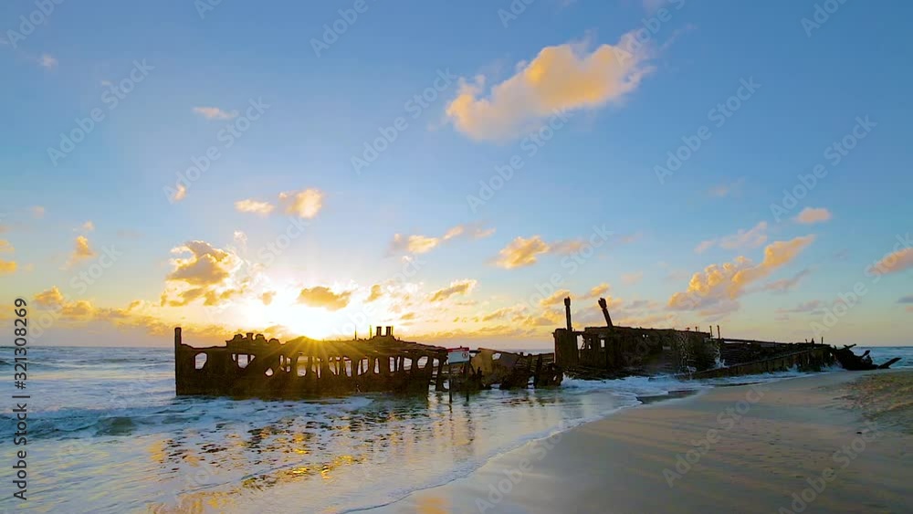 HD locked off panning left to right motion of the abandoned SS Maheno shipwreck which washed ashore on the coastline of Fraser Island in 1935 by a cyclone and left to rust,QLD,Australia HD locked off panning left to right motion of the abandoned SS Maheno shipwreck which washed ashore on the coastline of Fraser Island in 1935 by a cyclone and left to rust,QLD,Australia