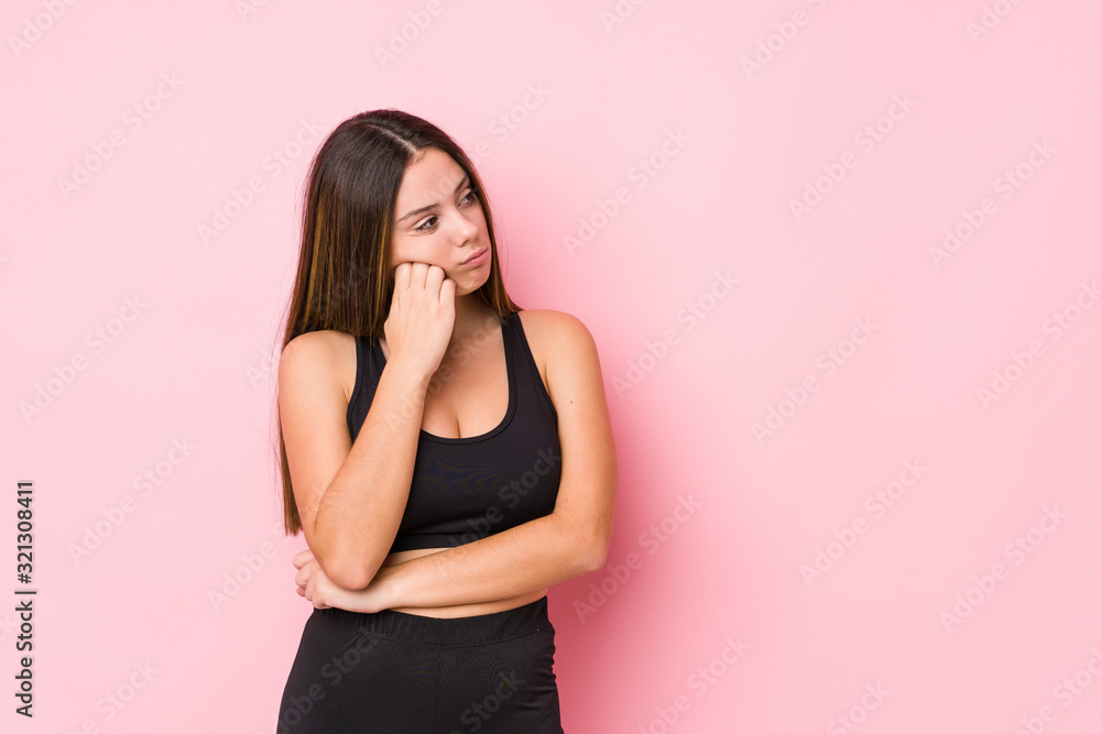 Young fitness caucasian woman isolated who feels sad and pensive, looking at copy space.