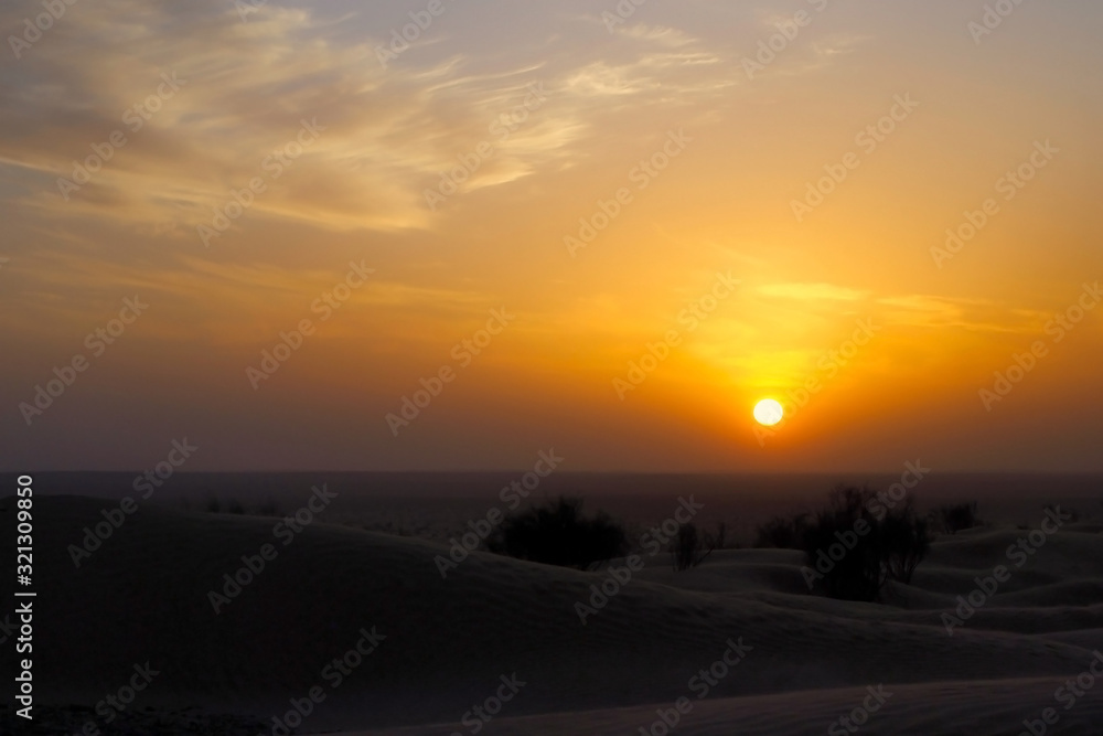 sand storm and sunset in desert