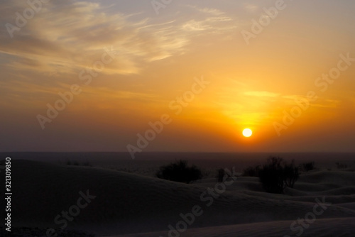sand storm and sunset in desert