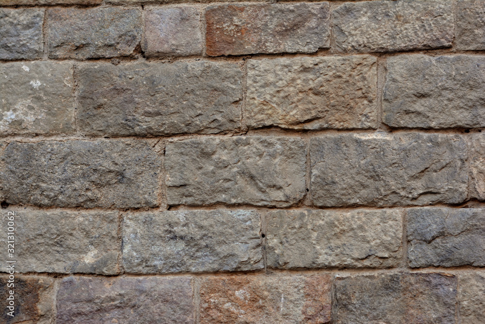 Fototapeta premium Ancient stones wall. Medieval facade, texture