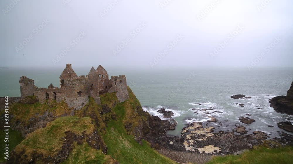 Wide, coastal castle ruins in Ireland Wide, coastal castle ruins in Ireland