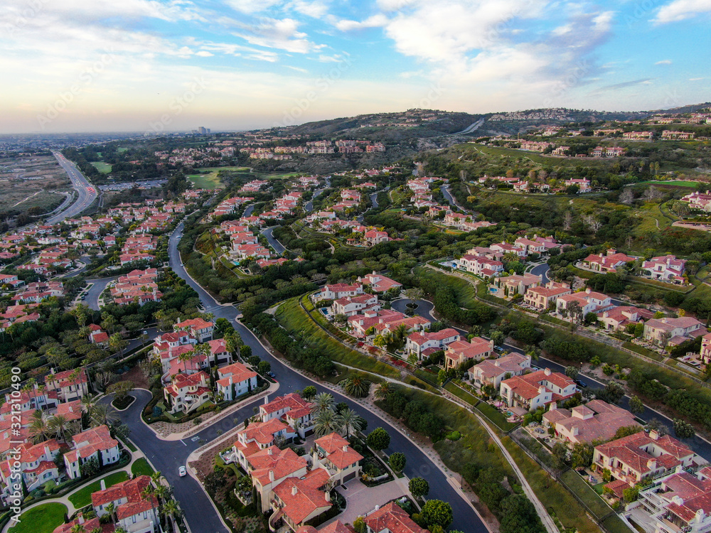  Crystal Cove neighborhood community in the Newport coast before sunset. Luxury big villa with pool on the cove.