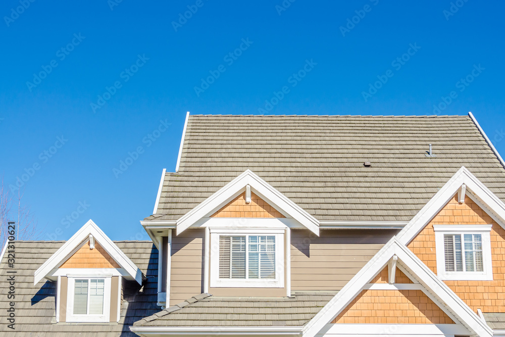 The roof of the house with nice window.