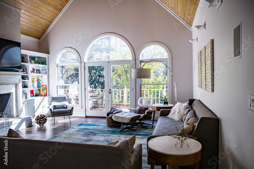 Cuadro en lienzo Mid century modern contemporary style living room den in a spacious open home wi