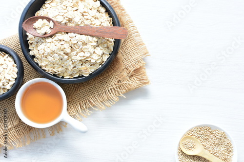 Natural oatmeal on light wooden background