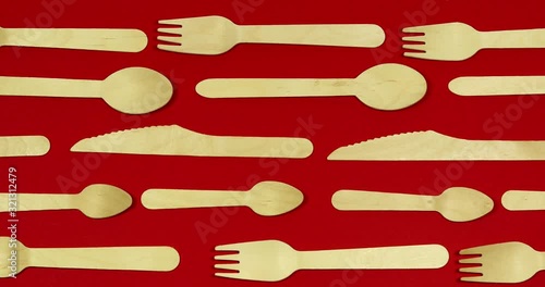 Stop motion Disposable appliance background for a meal of wood. Eco concept.