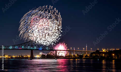 Photograph of fireworks. Jacques Cartier bridge with fireworks. Montreal Quebec. Fireworks.