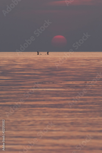 Stand up paddle boarding on quiet sea