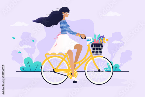 Spring day. Girl riding a bike.