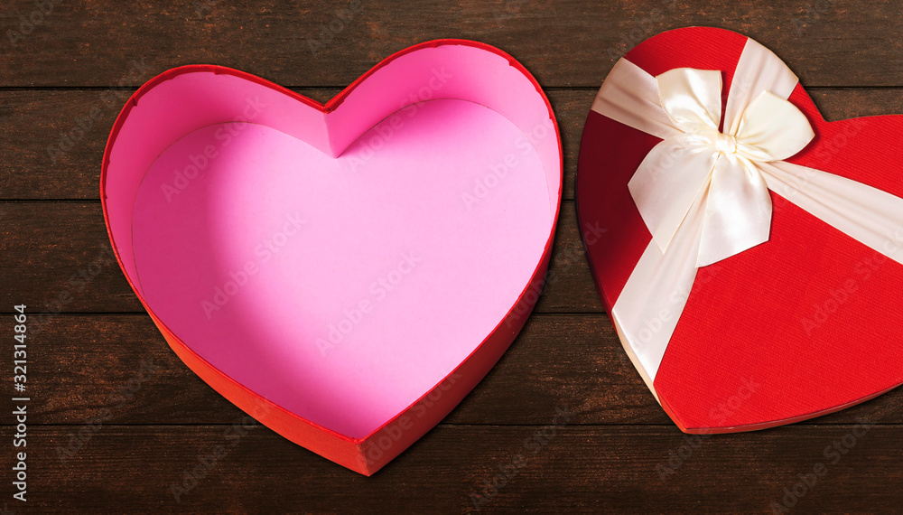 open heart shaped box on wood table open heart shaped box on wood table