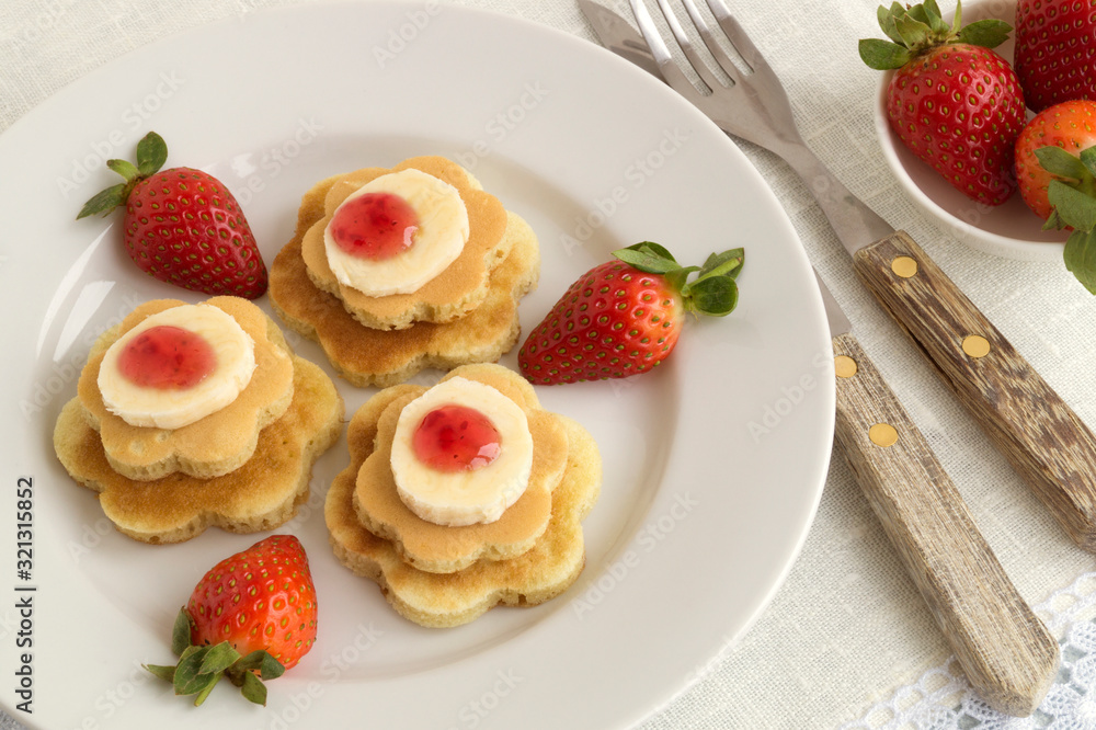 pancakes with jam and strawberries. pancakes with jam and strawberries.