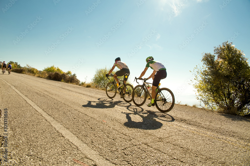 bike race in the morning on  uphill road