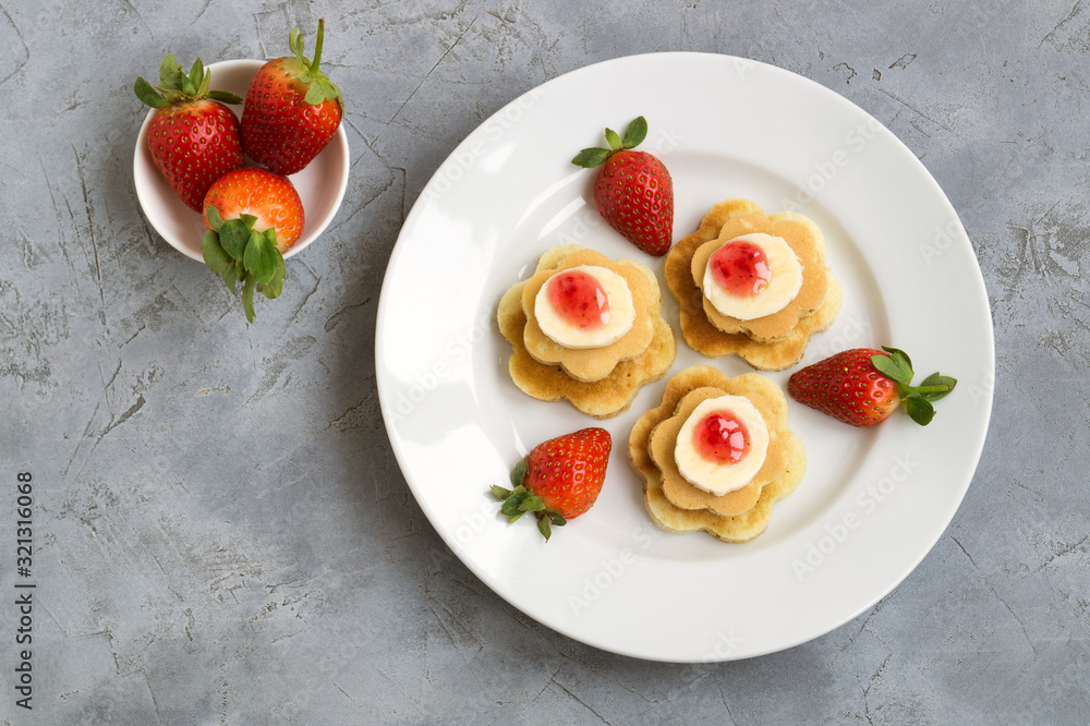 pancakes with jam and strawberries. pancakes with jam and strawberries.